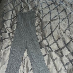 Never worn jump suit, flared bottoms, tight fit